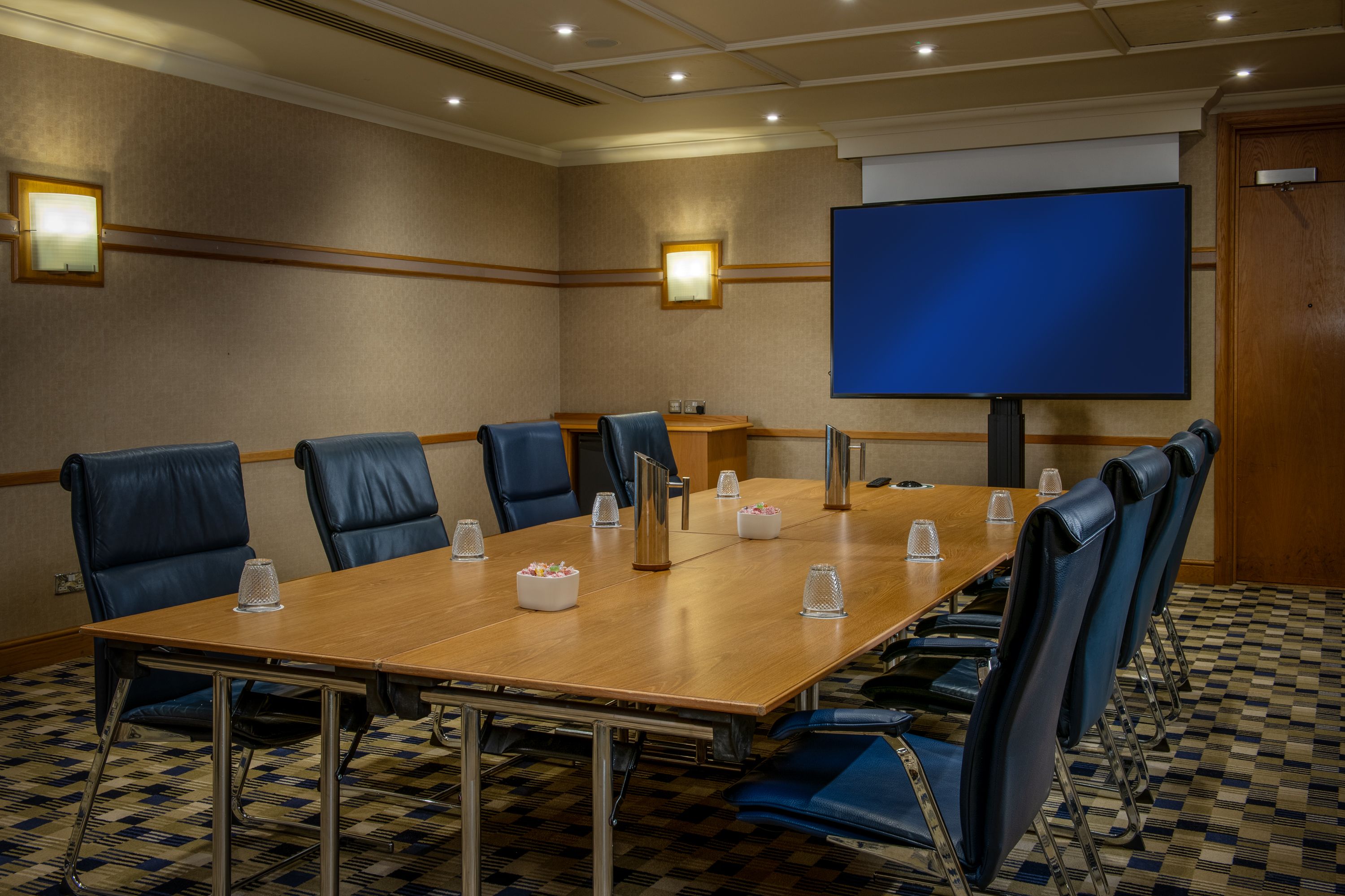 a meeting room with tv screen