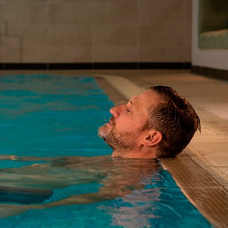 Man relaxing in pool