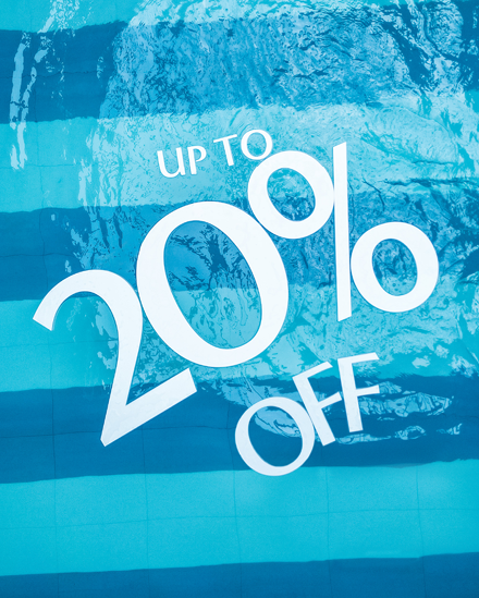 Floats on pool tat read "Up to 20% off"